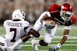ARLINGTON, TX - OCTOBER 03:  Wide receiver Jarius Wright #4 of the Arkansas Razorbacks is tackled by Terrence Frederick #7 of the Texas A&M Aggies at Dallas Cowboys Stadium on October 3, 2009 in Arlington, Texas.  (Photo by Ronald Martinez/Getty Images)