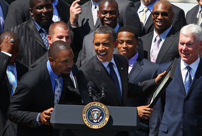 WASHINGTON, DC - AUGUST 12:  U.S. President Barack Obama (C) jokes with Charles Woodson (L), after recieving a ownership certificate during a reception for the National Football League Super Bowl XLV champions on the south lawn of the White House August 12, 2011 in Washington, DC. The Packers, lead by head coach Mike McCarthy, finished the 2010 season with a winning record of 10-6, and defeated the Pittsburgh Steelers 31-25 to take the championship.  (Photo by Mark Wilson/Getty Images)