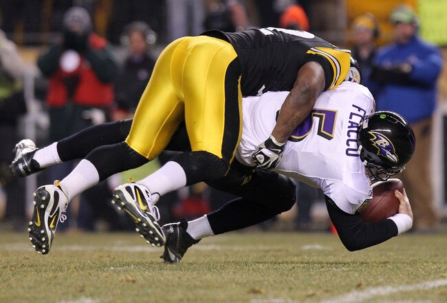 PITTSBURGH, PA - JANUARY 15:  Linebacker James Harrison #92 of the Pittsburgh Steelers sacks quarterback Joe Flacco #5 of the Baltimore Ravens during the AFC Divisional Playoff Game at Heinz Field on January 15, 2011 in Pittsburgh, Pennsylvania.  (Photo by Nick Laham/Getty Images)