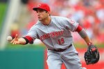 ST. LOUIS, MO -SEPTEMBER 4: Joey Votto #19 of the Cincinnati Reds tosses the ball to first base at Busch Stadium on September 4, 2011 in St. Louis, Missouri.  (Photo by Dilip Vishwanat/Getty Images)