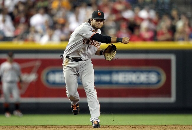 PHOENIX, AZ - JUNE 14:  Infielder Brandon Crawford #38 of the San Francisco Giants fields a ground ball out against the Arizona Diamondbacks during the Major League Baseball game at Chase Field on June 14, 2011 in Phoenix, Arizona. The Giants defeated the Diamondbacks 6-5.  (Photo by Christian Petersen/Getty Images)