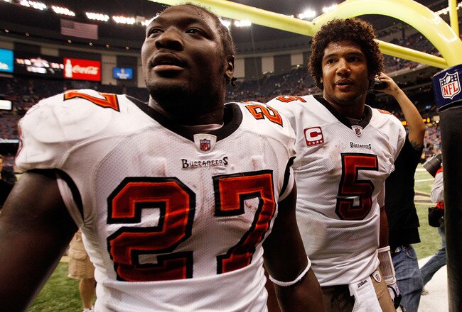 NEW ORLEANS, LA - JANUARY 02:  Quarterback Josh Freeman #5  celebrates with LeGarrette Blount #27 of the Tampa Bay Buccaneers after defeating the New Orleans Saints 23-13 at the Louisiana Superdome on January 2, 2011 in New Orleans, Louisiana.  (Photo by Chris Graythen/Getty Images)