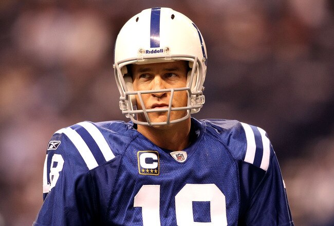 INDIANAPOLIS, IN - JANUARY 08:  Quarterback Peyton Manning #18 of the Indianapolis Colts looks on during warm ups against the New York Jets during their 2011 AFC wild card playoff game at Lucas Oil Stadium on January 8, 2011 in Indianapolis, Indiana.  (Photo by Andy Lyons/Getty Images)