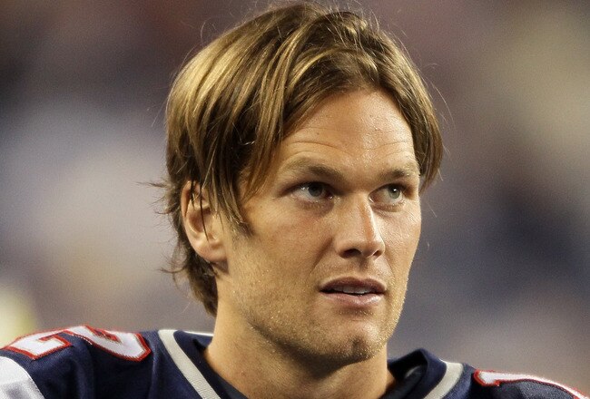 FOXBORO, MA - SEPTEMBER 01:  Tom Brady #12 of the New England Patriots looks on from the sideline in the second half against the New York Giants on September 1, 2011 at Gillette Stadium in Foxboro, Massachusetts.  (Photo by Elsa/Getty Images)