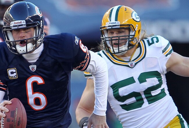 CHICAGO, IL - JANUARY 23:  Quarterback Jay Cutler #6 of the Chicago Bears runs the ball ahead of Clay Matthews #52 of the Green Bay Packers in the second quarter of the NFC Championship Game at Soldier Field on January 23, 2011 in Chicago, Illinois.  (Photo by Jamie Squire/Getty Images)