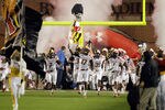 COLLEGE PARK, MD - SEPTEMBER 05: Quintin McCree #17 of the Maryland Terrapins carries the state flag as the team is introduced before the start of their game against the Miami Hurricanes at Byrd Stadium on September 5, 2011 in College Park, Maryland.  (Photo by Rob Carr/Getty Images)