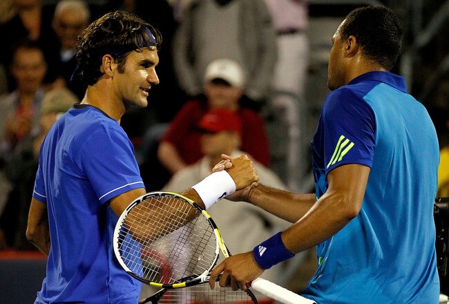 MONTREAL, QC - AUGUST 11: Roger Federer of Switzerland congratulates Jo-Wilfried Tsonga of France after their match during the Rogers Cup at Uniprix Stadium on August 11, 2011 in Montreal, Canada.  (Photo by Matthew Stockman/Getty Images)