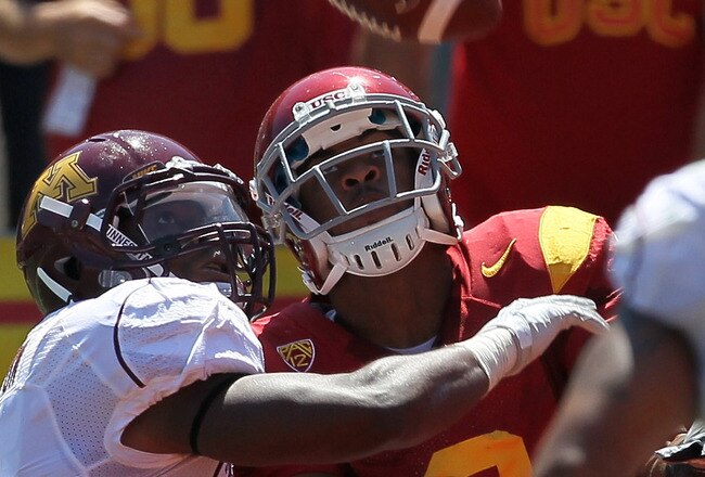 LOS ANGELES - SEPTEMBER 3: Wide receiver Robert Woods #2 of the USC Trojans makes a 43  yard touchdown reception over safety Kim Royston #3 of the Minnesota Golden Gophers in the second quarter at the Los Angeles Memorial Coliseum on September 3, 2011 in Los Angeles, California.  (Photo by Stephen Dunn/Getty Images)