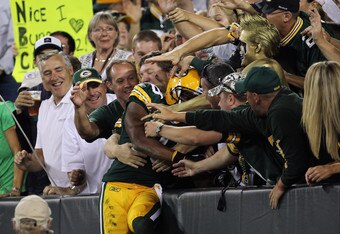 GREEN BAY, WI - SEPTEMBER 08:   Randall Cobb #18 of the Green Bay Packers celebrates after scoring a touchdown against the New Orleans Saints during the season opening game at Lambeau Field on September 8, 2011 in Green Bay, Wisconsin.  (Photo by Jonathan Daniel/Getty Images)