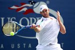 NEW YORK, NY - SEPTEMBER 08:  Andy Roddick of the United States returns a shot against David Ferrer of Spain on court 13 during Day Eleven of the 2011 US Open at the USTA Billie Jean King National Tennis Center on September 8, 2011 in the Flushing neighborhood of the Queens borough of New York City.  (Photo by Al Bello/Getty Images)