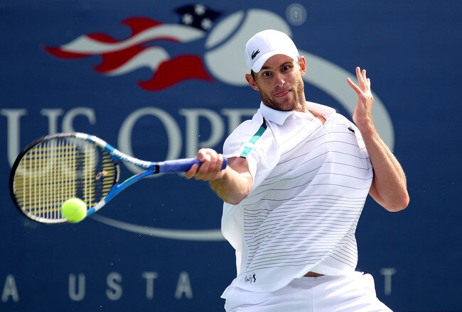 NEW YORK, NY - SEPTEMBER 08:  Andy Roddick of the United States returns a shot against David Ferrer of Spain on court 13 during Day Eleven of the 2011 US Open at the USTA Billie Jean King National Tennis Center on September 8, 2011 in the Flushing neighborhood of the Queens borough of New York City.  (Photo by Al Bello/Getty Images)
