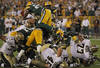 GREEN BAY, WI - SEPTEMBER 08: Members of the Green Bay Packer defense stop the New Orleans Saints short of the goal on the final play of the game during the NFL opening season game at Lambeau Field on September 8, 2011 in Green Bay, Wisconsin. The Packers defeated the Saints 42-34. (Photo by Jonathan Daniel/Getty Images)
