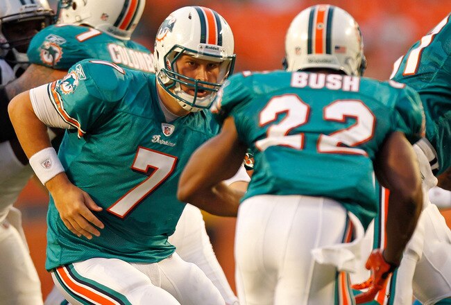 MIAMI GARDENS, FL - AUGUST 19:  Chad Henne #7 of the Miami Dolphins looks to hand off th Reggie Bush #22 during a Preseason NFL game against the Carolina Panthers at Sun Life Stadium on August 19, 2011 in Miami Gardens, Florida.  (Photo by Mike Ehrmann/Getty Images)