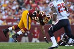 LANDOVER - SEPTEMBER 19:  Larry Johnson #27 of the Washington Redskins runs the ball against the Houston Texans at FedExField on September 19, 2010 in Landover, Maryland. The Texans defeated the Redskins in overtime 30-27. (Photo by Larry French/Getty Images)