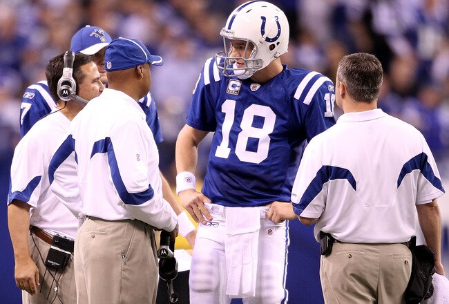 INDIANAPOLIS, IN - JANUARY 08:  Quarterback Peyton Manning #18 of the Indianapolis Colts talks with head coach Jim Caldwell against the New York Jets during their 2011 AFC wild card playoff game at Lucas Oil Stadium on January 8, 2011 in Indianapolis, Indiana. The Jets won 17-16.  (Photo by Andy Lyons/Getty Images)