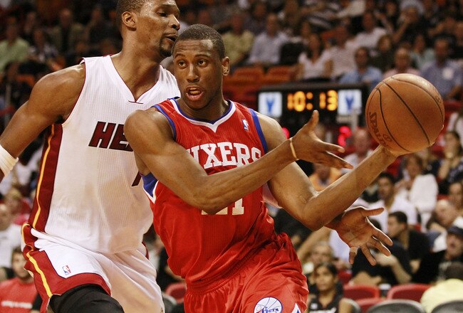 MIAMI, FL - MARCH 25:  Forward Thaddeus Young #21 of the Philadelphia Sixers drives against Forward Chris Bosh #1 of the Miami Heat at American Airlines Arena on March 25, 2011 in Miami, Florida. The Heat defeated the Sixers 111-99. NOTE TO USER: User expressly acknowledges and agrees that, by downloading and/or using this Photograph, User is consenting to the terms and conditions of the Getty Images License Agreement.  (Photo by Marc Serota/Getty Images)