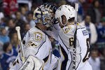 VANCOUVER, CANADA - MAY 7: Goalie Pekka Rinne #35 of the Nashville Predators if congratulated by Shea Weber #6 after defeating the Vancouver Canucks 4-3 in Game Five of the Western Conference Semifinals during the 2011 NHL Stanley Cup Playoffs on May 07, 2011 at Rogers Arena in Vancouver, British Columbia, Canada.  (Photo by Rich Lam/Getty Images)