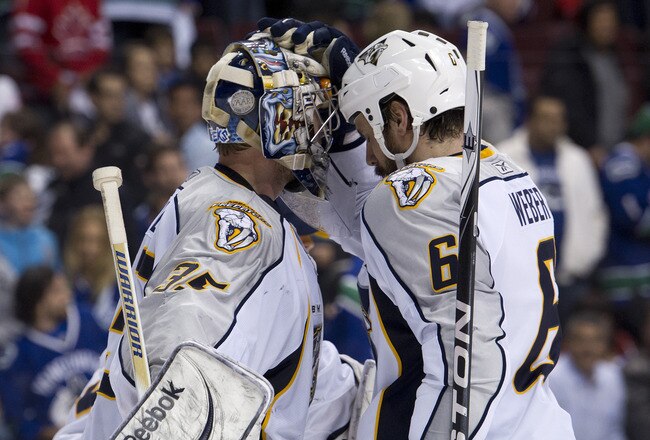 VANCOUVER, CANADA - MAY 7: Goalie Pekka Rinne #35 of the Nashville Predators if congratulated by Shea Weber #6 after defeating the Vancouver Canucks 4-3 in Game Five of the Western Conference Semifinals during the 2011 NHL Stanley Cup Playoffs on May 07, 2011 at Rogers Arena in Vancouver, British Columbia, Canada.  (Photo by Rich Lam/Getty Images)