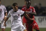 BRIDGEVIEW, IL - AUGUST 18: Patrick Nyarko #14 of the Chicago Fire tries to hold back Perry Kitchen #23 of D.C. United during an MLS match at Toyota Park on August 18, 2011 in Bridgeview, Illinois. The Fire and D.C. United tied 1-1. (Photo by Jonathan Daniel/Getty Images)