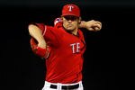 ARLINGTON, TX - OCTOBER 15: C.J. Wilson #36 of the Texas Rangers pitches against the New York Yankees in Game One of the ALCS during the 2010 MLB Playoffs at Rangers Ballpark in Arlington on October 15, 2010 in Arlington, Texas.  (Photo by Stephen Dunn/Getty Images)