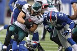 EAST RUTHERFORD, NJ - DECEMBER 19:  Aaron Ross #31 of the New York Giants tackles Riley Cooper #14 of the Philadelphia Eagles during their game on December 19, 2010 at The New Meadowlands Stadium in East Rutherford, New Jersey.  (Photo by Al Bello/Getty Images)