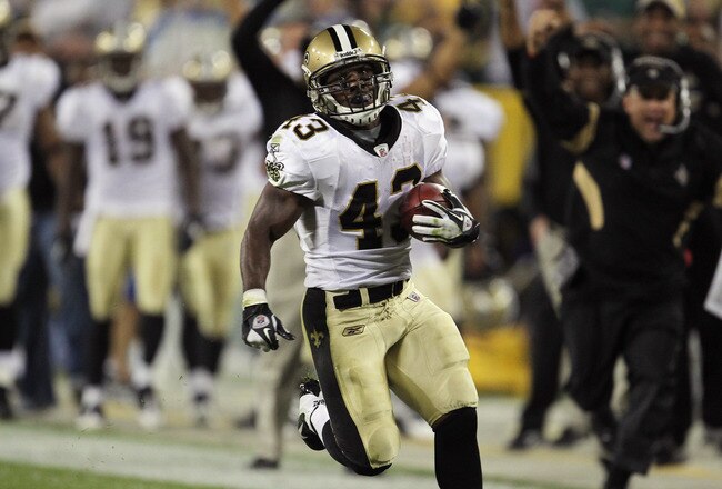 GREEN BAY, WI - SEPTEMBER 08:   Darren Sproles #43 of the New Orleans Saints returns a punt for a touchdown against the Green Bay Packers in the second quarter during the season opening game at Lambeau Field on September 8, 2011 in Green Bay, Wisconsin.  (Photo by Jonathan Daniel/Getty Images)