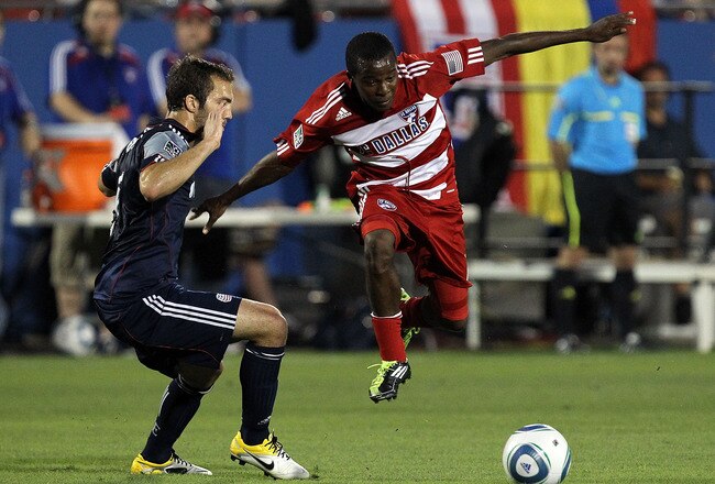 FRISCO, TX - JUNE 04:  Marvin Chavez #18 of FC Dallas dribbles the ball against AJ Soares #5 of the New England Revolution at Pizza Hut Park on June 4, 2011 in Frisco, Texas.  (Photo by Ronald Martinez/Getty Images)