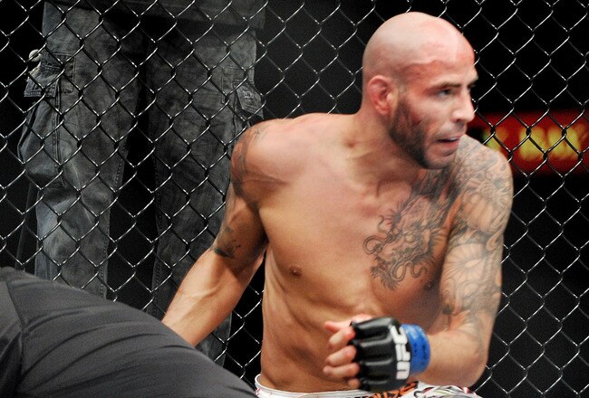 LAS VEGAS - NOVEMBER 21: Ben Saunders (R) knocks out Marcus Davis (L) during their Welterweight Fight at the UFC 106 at Mandalay Bay Events Center on November 21, 2009 in Las Vegas, Nevada. (Photo by Jon Kopaloff/Getty Images)