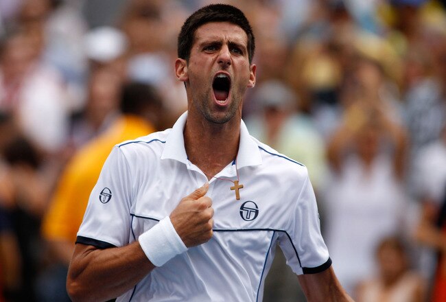 NEW YORK, NY - SEPTEMBER 10:  Novak Djokovic of Serbia reacts after he won his match against Roger Federer of Switzerland during Day Thirteen of the 2011 U.S. Open at the USTA Billie Jean King National Tennis Center on September 10, 2011 in the Flushing neighborhood of the Queens borough of New York City.  (Photo by Mike Stobe/Getty Images for USTA)