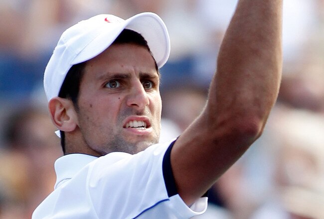 NEW YORK, NY - SEPTEMBER 10:  Novak Djokovic of Serbia celebrates during his match against Roger Federer of Switzerland during Day Thirteen of the 2011 U.S. Open at the USTA Billie Jean King National Tennis Center on September 10, 2011 in the Flushing neighborhood of the Queens borough of New York City.  (Photo by Mike Stobe/Getty Images for USTA)