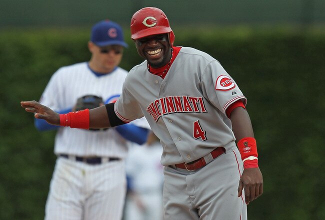 CHICAGO, IL - SEPTEMBER 05: Brandon Phillips #4 of the Cincinnati Reds laughs at outfielder Marlon Byrd of the Chicago Cubs as he stands near 2nd base at Wrigley Field on September 5, 2011 in Chicago, Illinois. The Cubs defeated the Reds 4-3.  (Photo by Jonathan Daniel/Getty Images)