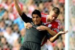 STOKE ON TRENT, ENGLAND - SEPTEMBER 10:  Luis Suarez of Liverpool (L) holds off Ryan Shawcross of Stoke during the Barclays Premier League match between Stoke City and Liverpool at Britannia Stadium on September 10, 2011 in Stoke on Trent, England.  (Photo by Scott Heavey/Getty Images)