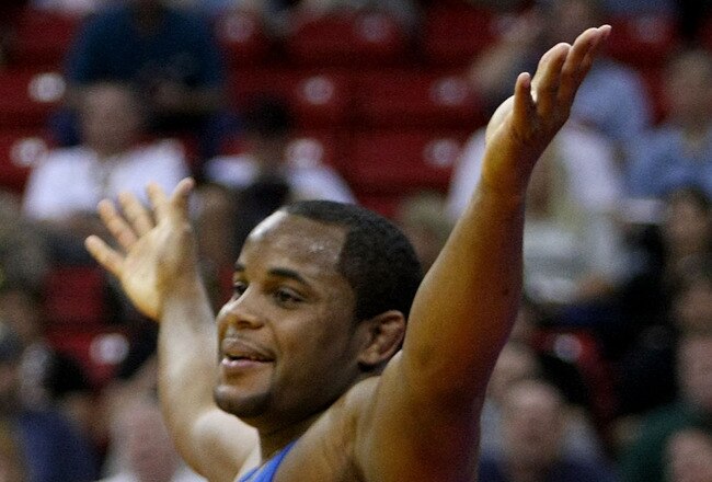 LAS VEGAS - JUNE 15:  Daniel Cormier (blue) celebrates his win over Damion Hahn (red) in the Freestyle 96kg division championship match during the USA Olympic trials for wrestling and judo on June 15, 2008 at the Thomas & Mack Center in Las Vegas, Neveda.  (Photo by Jonathan Ferrey/Getty Images)