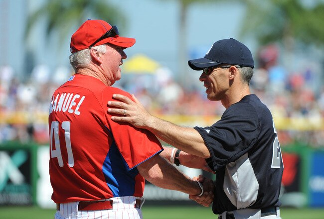 CLEARWATER, FL - FEBRUARY 27:  Manager Joe Girardi #28 of the New York Yankees talks with manager Charlie Manuel #41 of  the Philadelphia Phillies before play February 27, 2011 at Bright House Field in Clearwater, Florida.  (Photo by Al Messerschmidt/Getty Images)