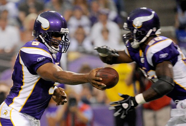 MINNEAPOLIS, MN - AUGUST 27: Donovan McNabb #5 of the Minnesota Vikings hands the ball to Adrian Peterson #28 in the first half on August 27, 2011 at Hubert H. Humphrey Metrodome in Minneapolis, Minnesota. (Photo by Hannah Foslien/Getty Images)