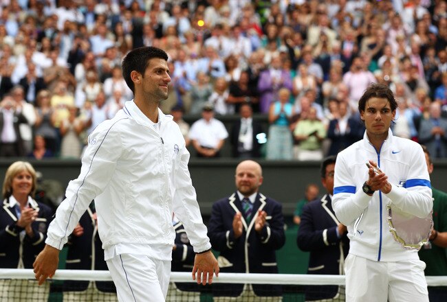 LONDON, ENGLAND - JULY 03:  Runner-up Rafael Nadal of Spain (R) claps for winner Novak Djokovic of Serbia after their final round Gentlemen's match  on Day Thirteen of the Wimbledon Lawn Tennis Championships at the All England Lawn Tennis and Croquet Club on July 3, 2011 in London, England.  (Photo by Clive Brunskill/Getty Images)