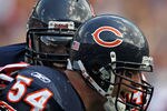 CHICAGO, IL - SEPTEMBER 11:  Brian Urlacher #54 and Chris Harris #46 of the Chicago Bears celebrate Urlacher's touchdown run against the Atlanta Falcons at Soldier Field on September 11, 2011 in Chicago, Illinois. The Bears defeated the Falcons 30-12.  (Photo by Jonathan Daniel/Getty Images)