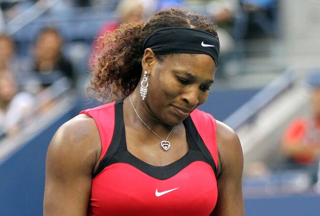 NEW YORK, NY - SEPTEMBER 11:  Serena Williams of the United States reacts while playing against Samantha Stosur of Australia during the Women's Singles Final on Day Fourteen of the 2011 US Open at the USTA Billie Jean King National Tennis Center on September 11, 2011 in the Flushing neighborhood of the Queens borough of New York City.  (Photo by Matthew Stockman/Getty Images)