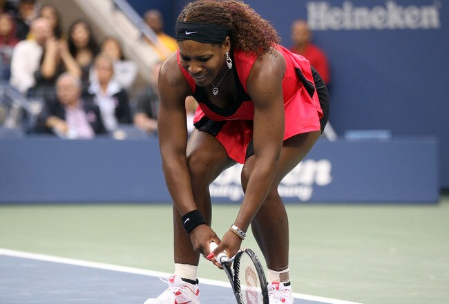 NEW YORK, NY - SEPTEMBER 11:  Serena Williams of the United States reacts while playing against Samantha Stosur of Australia during the Women's Singles Final on Day Fourteen of the 2011 US Open at the USTA Billie Jean King National Tennis Center on September 11, 2011 in the Flushing neighborhood of the Queens borough of New York City.  (Photo by Matthew Stockman/Getty Images)