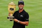 AKRON, OH - AUGUST 07:  Adam Scott of Australia celebrates with the Gary Player Cup trophy after his four-stroke victory during the final round of the World Golf Championships-Bridgestone Invitational on the South Course at Firestone Country Club on August 7, 2011 in Akron, Ohio.  (Photo by Andy Lyons/Getty Images)