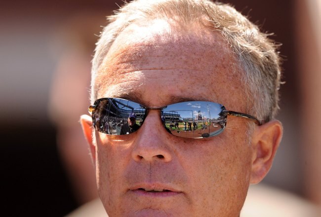 DENVER - APRIL 06:  Dan O'Dowd, Executive Vice President and General Manager of the Colorado Rockies looks out onto the field before the MLB game between the Arizona Diamondbacks at Coors Field on April 6, 2008 in Denver, Colorado.  (Photo by Steve Dykes/Getty Images)