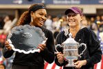 NEW YORK, NY - SEPTEMBER 11:  Samantha Stosur (R) of Australia celebrates with the championship trophy alongside Serena Williams (L) of the United States  who poses with the second place trophy after their Women's Singles Final match on Day Fourteen of the 2011 US Open at the USTA Billie Jean King National Tennis Center on September 11, 2011 in the Flushing neighborhood of the Queens borough of New York City.  (Photo by Mike Stobe/Getty Images for USTA)