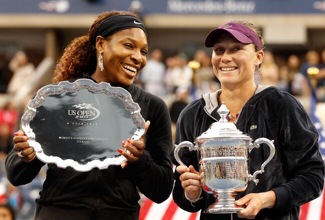 NEW YORK, NY - SEPTEMBER 11:  Samantha Stosur (R) of Australia celebrates with the championship trophy alongside Serena Williams (L) of the United States  who poses with the second place trophy after their Women's Singles Final match on Day Fourteen of the 2011 US Open at the USTA Billie Jean King National Tennis Center on September 11, 2011 in the Flushing neighborhood of the Queens borough of New York City.  (Photo by Mike Stobe/Getty Images for USTA)