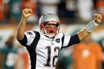 MIAMI GARDENS, FL - SEPTEMBER 12:  Quarterback Tom Brady #12 of the New England Patriots celebrates a touchdown against the Miami Dolphins at Sun Life Stadium on September 12, 2011 in Miami Gardens, Florida.  (Photo by Marc Serota/Getty Images)