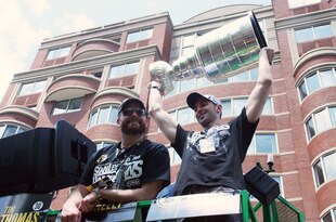 BOSTON, MA  - JUNE 18: Tim Thomas and Zdeno Chara of the Boston Bruins react to cheers during the Stanley Cup victory parade on June 18, 2011 in Boston, Massachusetts.  (Photo by Gail Oskin/Getty Images)
