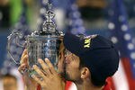 NEW YORK, NY - SEPTEMBER 12:  Novak Djokovic of Serbia kisses the trophy as he celebrates defeating Rafael Nadal of Spain during the Men's Final on Day Fifteen of the 2011 US Open at the USTA Billie Jean King National Tennis Center on September 12, 2011 in the Flushing neighborhood of the Queens borough of New York City.  (Photo by Clive Brunskill/Getty Images)
