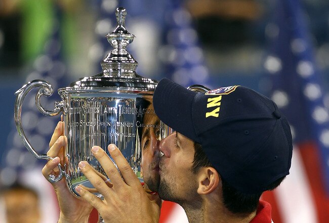 NEW YORK, NY - SEPTEMBER 12:  Novak Djokovic of Serbia kisses the trophy as he celebrates defeating Rafael Nadal of Spain during the Men's Final on Day Fifteen of the 2011 US Open at the USTA Billie Jean King National Tennis Center on September 12, 2011 in the Flushing neighborhood of the Queens borough of New York City.  (Photo by Clive Brunskill/Getty Images)