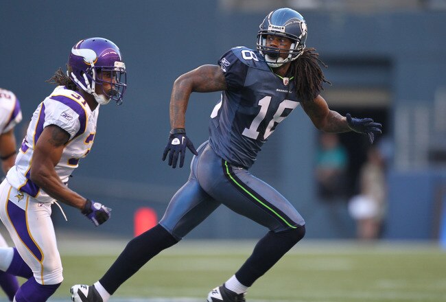 SEATTLE - AUGUST 20:  Wide receiver Sidney Rice #18 of the Seattle Seahawks runs a pass route against cornerback Chris Cook #31 of the Minnesota Vikings at CenturyLink Field on August 20, 2011 in Seattle, Washington. The Vikings won 20-7. (Photo by Otto Greule Jr/Getty Images)