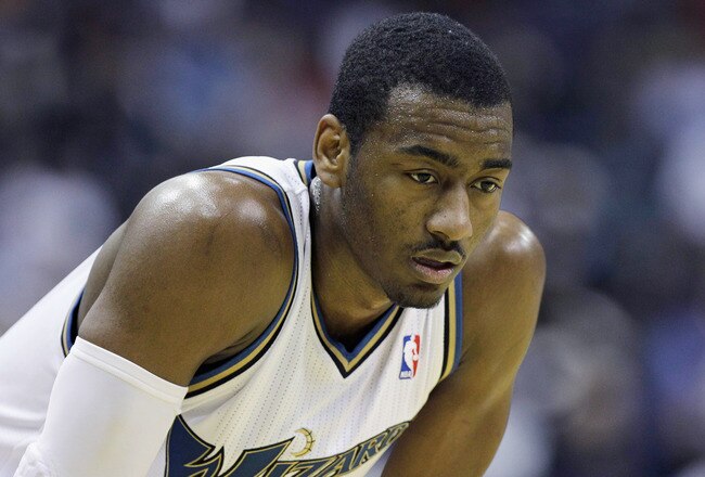 WASHINGTON, DC - MARCH 14: John Wall #2 of the Washington Wizards looks on against the Oklahoma City Thunderduring the second half at the Verizon Center on March 14, 2011 in Washington, DC. NOTE TO USER: User expressly acknowledges and agrees that, by downloading and/or using this Photograph, User is consenting to the terms and conditions of the Getty Images License Agreement.  (Photo by Rob Carr/Getty Images)