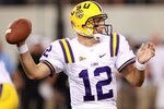 ARLINGTON, TX - SEPTEMBER 03:  Jarrett Lee #12 of the LSU Tigers throws against the Oregon Ducks at Cowboys Stadium on September 3, 2011 in Arlington, Texas.  (Photo by Ronald Martinez/Getty Images)